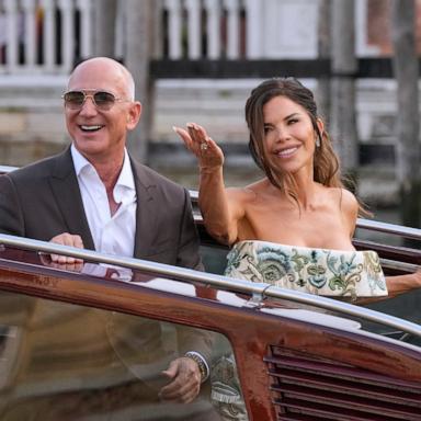 PHOTO: Jeff Bezos, left, and Lauren Sanchez leave a hotel for their pre-wedding reception, in Venice, Italy, June 26, 2025. 