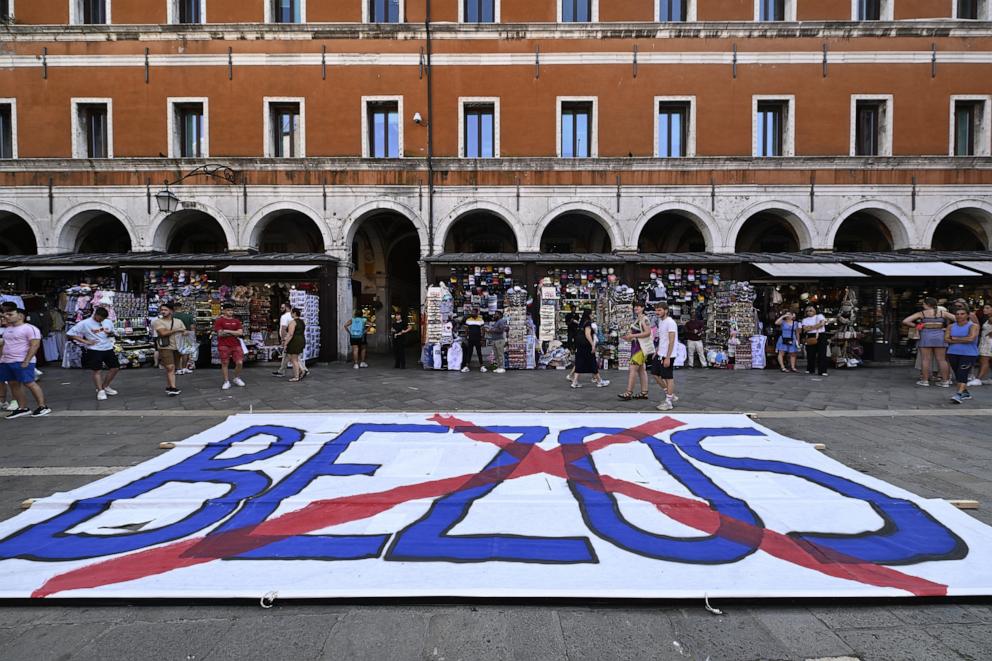 PHOTO: People gather to protest against the wedding of Amazon Founder and CEO Jeff Bezos and journalist Lauren Sanchez in Venice, June 13, 2025. 