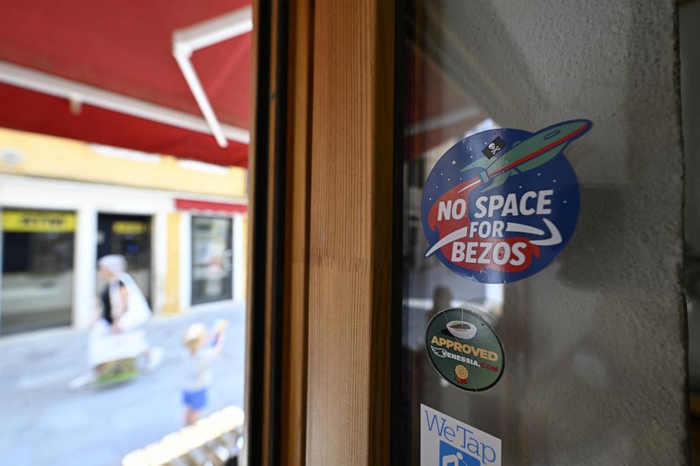 PHOTO: A sticker reading "No Space for Bezos" is pictured in Venice where the billionaire Jeff Bezos will marry is fiancee, journalist Lauren Sanchez at the end of the month, June 13, 2025. 