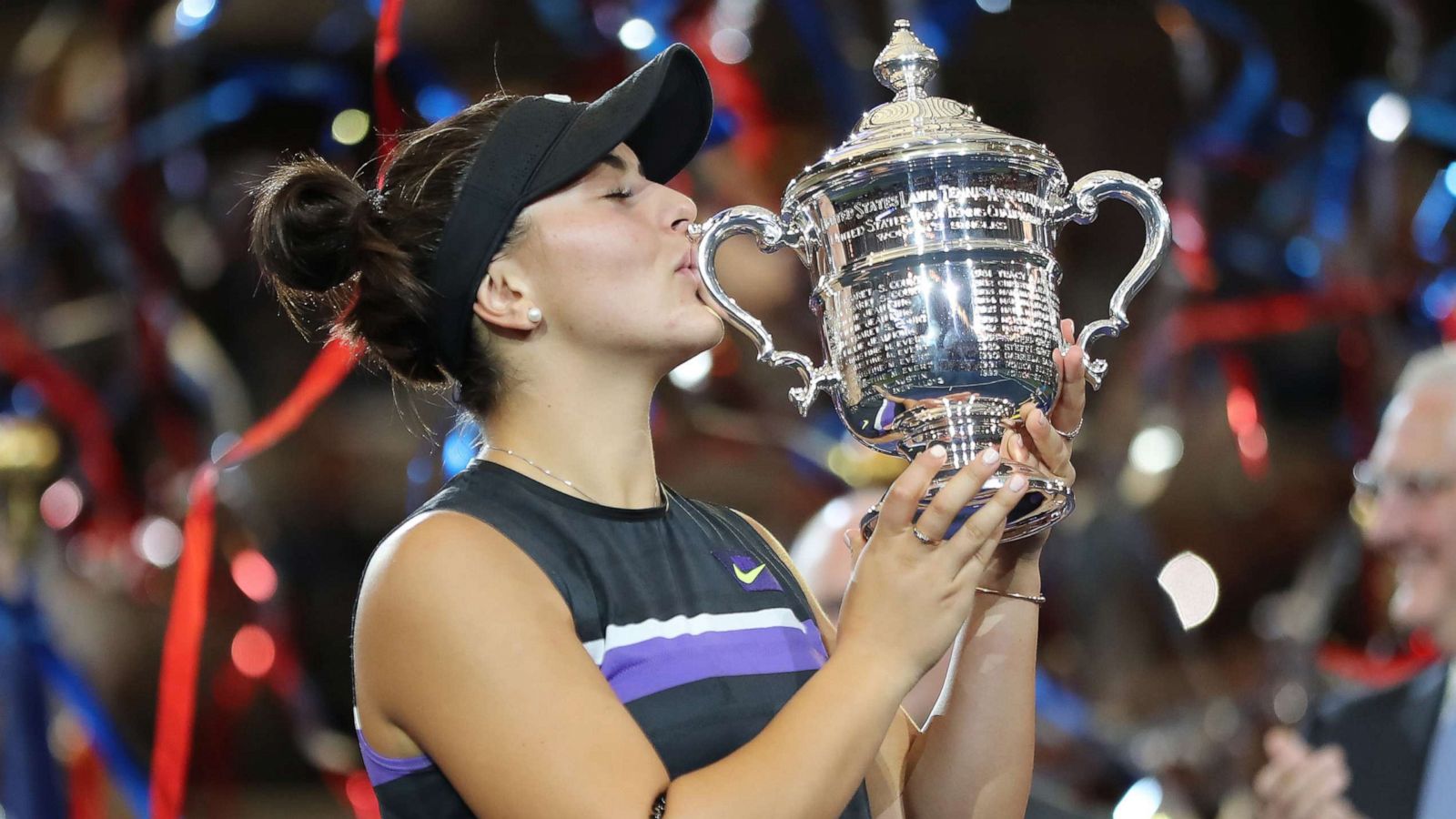 Bianca Andreescu celebrates with the championship trophy after winning the Women's Singles final against against Serena Williams at the 2019 US Open at the USTA Billie Jean King National Tennis Center, Sept. 7, 2019 in the Queens borough of New York City.