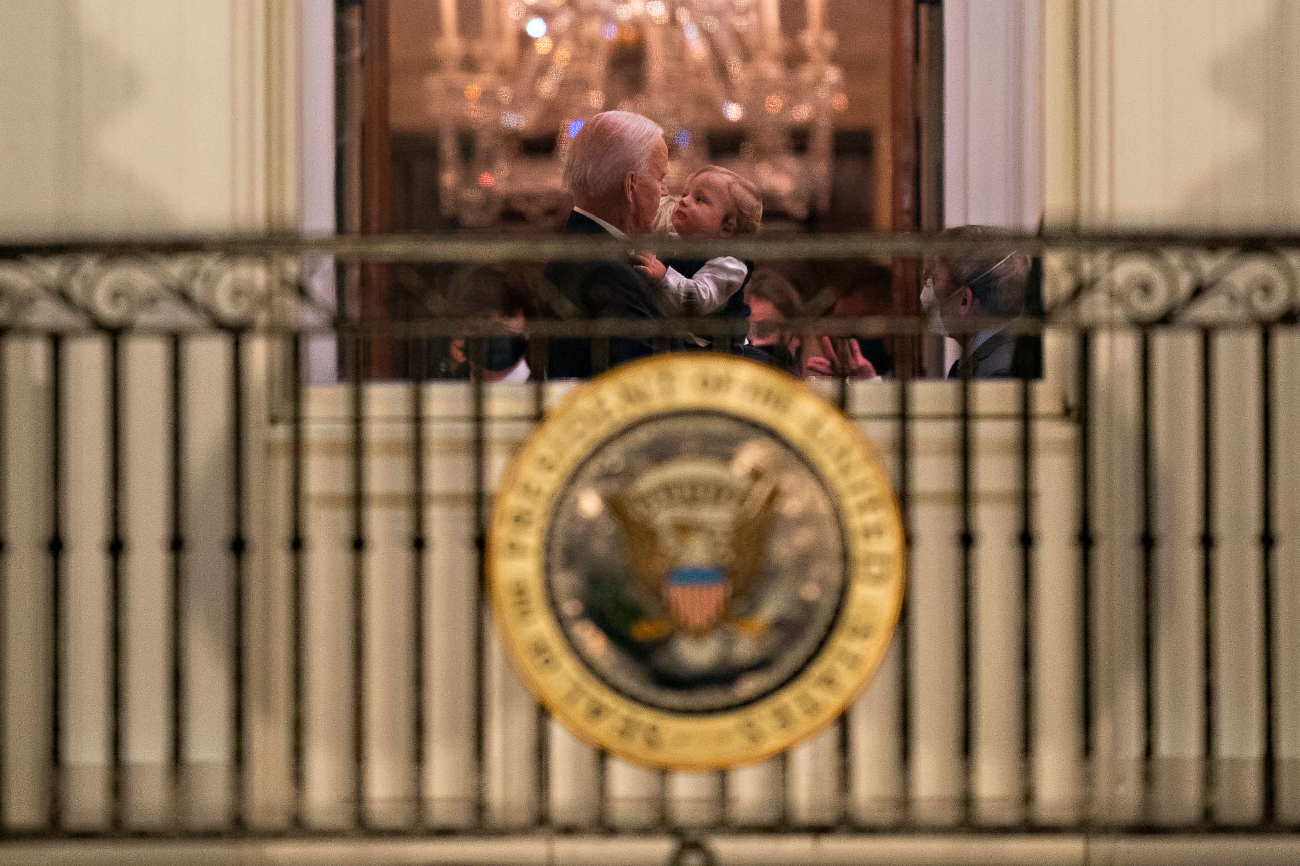 PHOTO: President Joe Biden holds his grandson Beau Biden at the White House, Inauguration night, Jan. 20, 2021, in Washington.