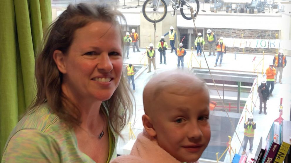 PHOTO: Construction crew lends their crane to surprise a 10-year-old fighting cancer at Duke University Hospital with a bike.