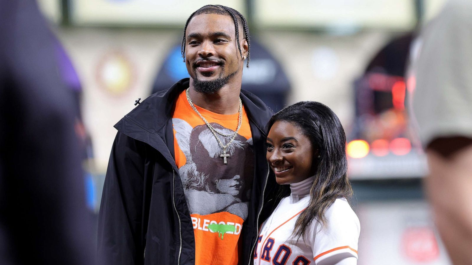 PHOTO: Simone Biles and Jonathan Owens pose on the field prior to Game One of the 2022 World Series between the Philadelphia Phillies and the Houston Astros at Minute Maid Park, Oct. 28, 2022 in Houston, Texas.