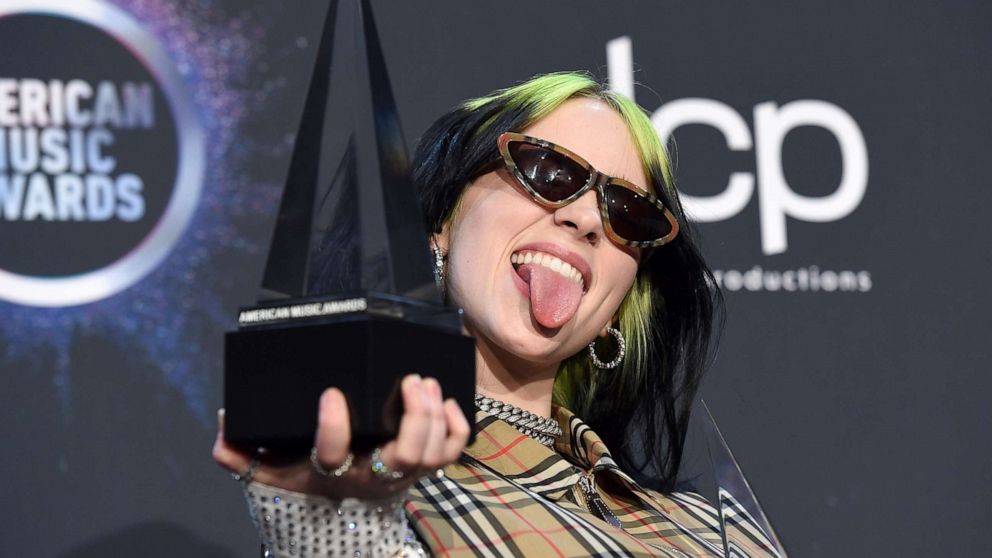 PHOTO: Billie Eilish poses in the press room with the award for new artist of the year and favorite alternative rock artist at the American Music Awards on Sunday, Nov. 24, 2019, at the Microsoft Theater in Los Angeles.