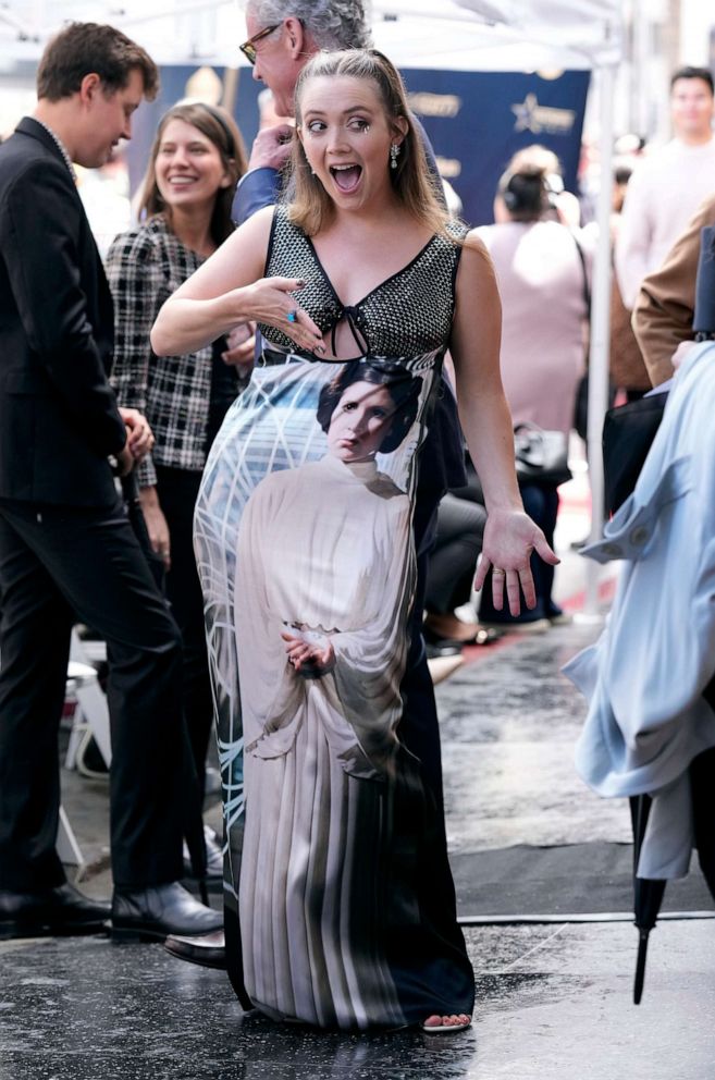PHOTO: Billie Lourd wears a dress with an image of her late mother actress Carrie Fisher at a ceremony honoring Fisher with a posthumous star on the Hollywood Walk of Fame in Los Angeles, May 4, 2023.