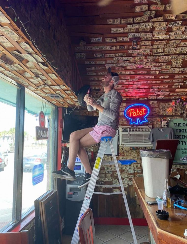 PHOTO: Jennifer Knox removed $3,714 in bills from the walls of her Tybee Island, Georgia bar to give to unemployed staff.