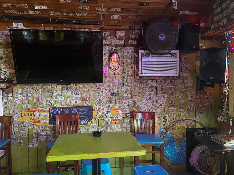 PHOTO: Jennifer Knox removed $3,714 in bills from the walls of her Tybee Island, Georgia bar to give to unemployed staff.