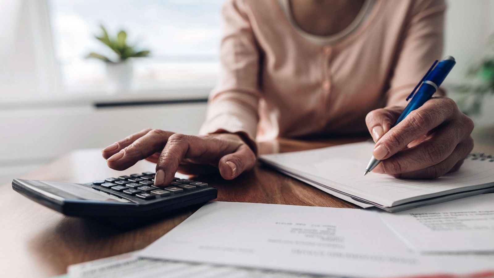 PHOTO: A person appears to be paying bills in this stock photo.