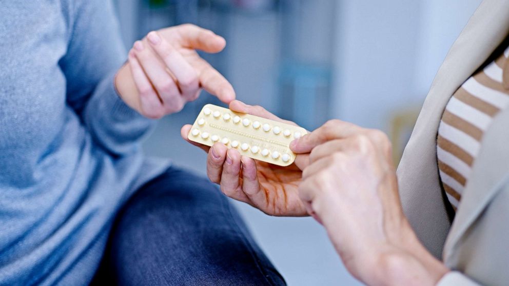 PHOTO: A stock photo of a doctor discussing oral contraception with a patient.