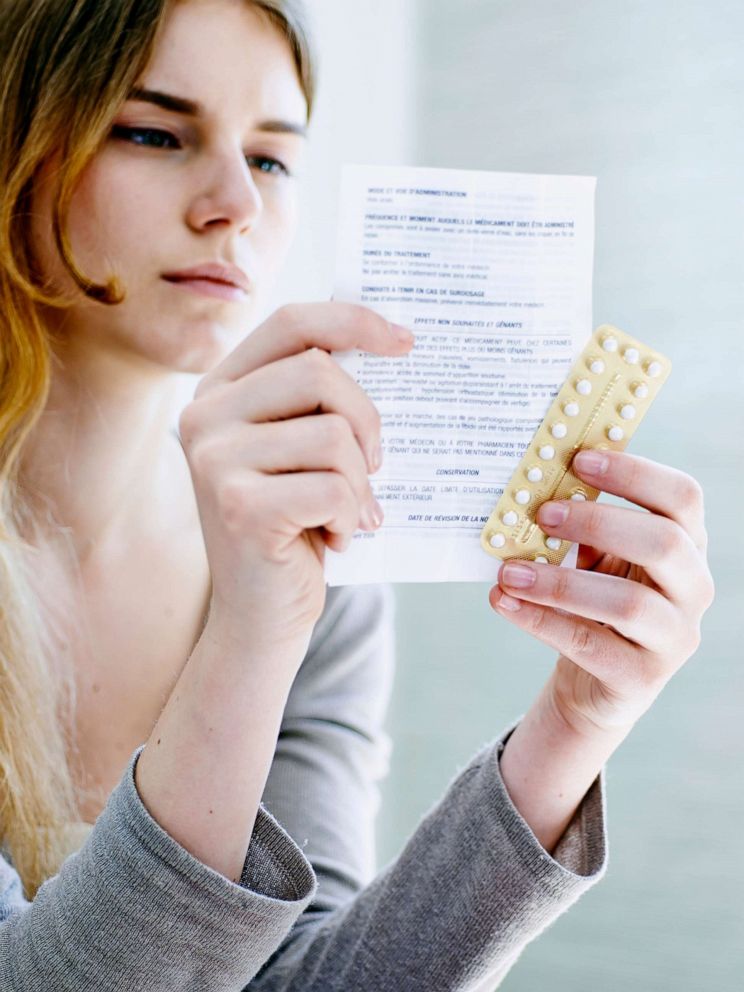 PHOTO: In this undated file photo, a woman is reading a contraceptive pill instruction sheet.
