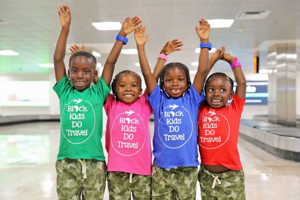 PHOTO: Kids pose at the airport in 'Black Kids DO Travel" shirts. 