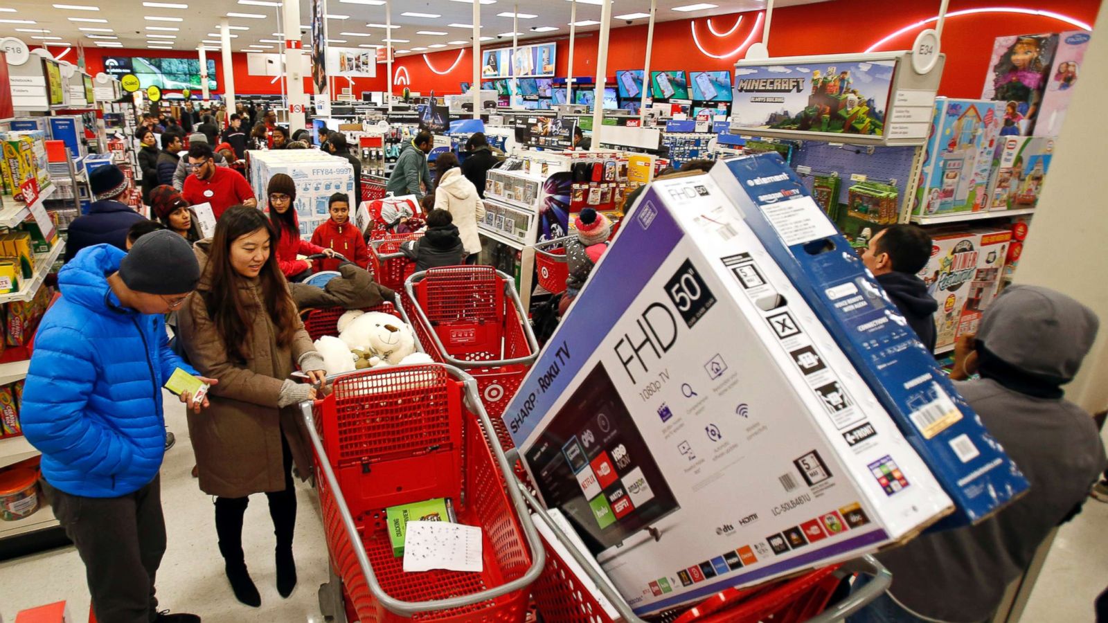 PHOTO: Bargain hunters shop at as it offers its lowest prices of the season on items like TVs and electronics as on, Nov. 23, 2017, in Jersey City, N.J.