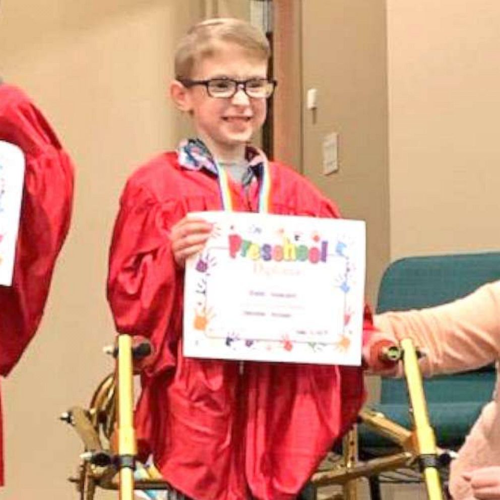 VIDEO: Boy with spina bifida shines as he walks for first time at preschool graduation 