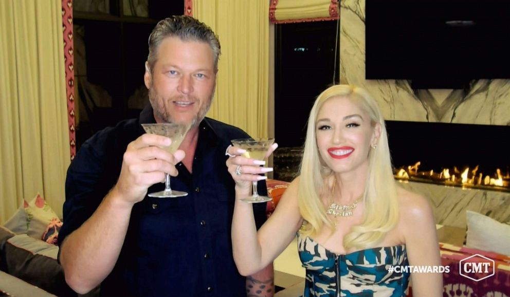 PHOTO: In this video image provided by CMT, Blake Shelton and Gwen Stefani toast as they accept the collaboration of the year award for "Nobody But You" during the Country Music Television awards airing on Oct. 21, 2020.