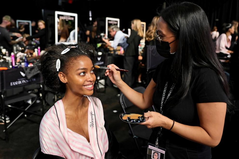 PHOTO: Blesnya Minher prepares backstage at the Victoria's Secret Fashion Show 2024 at Duggal Greenhouse on Oct. 15, 2024, in Brooklyn, New York. 