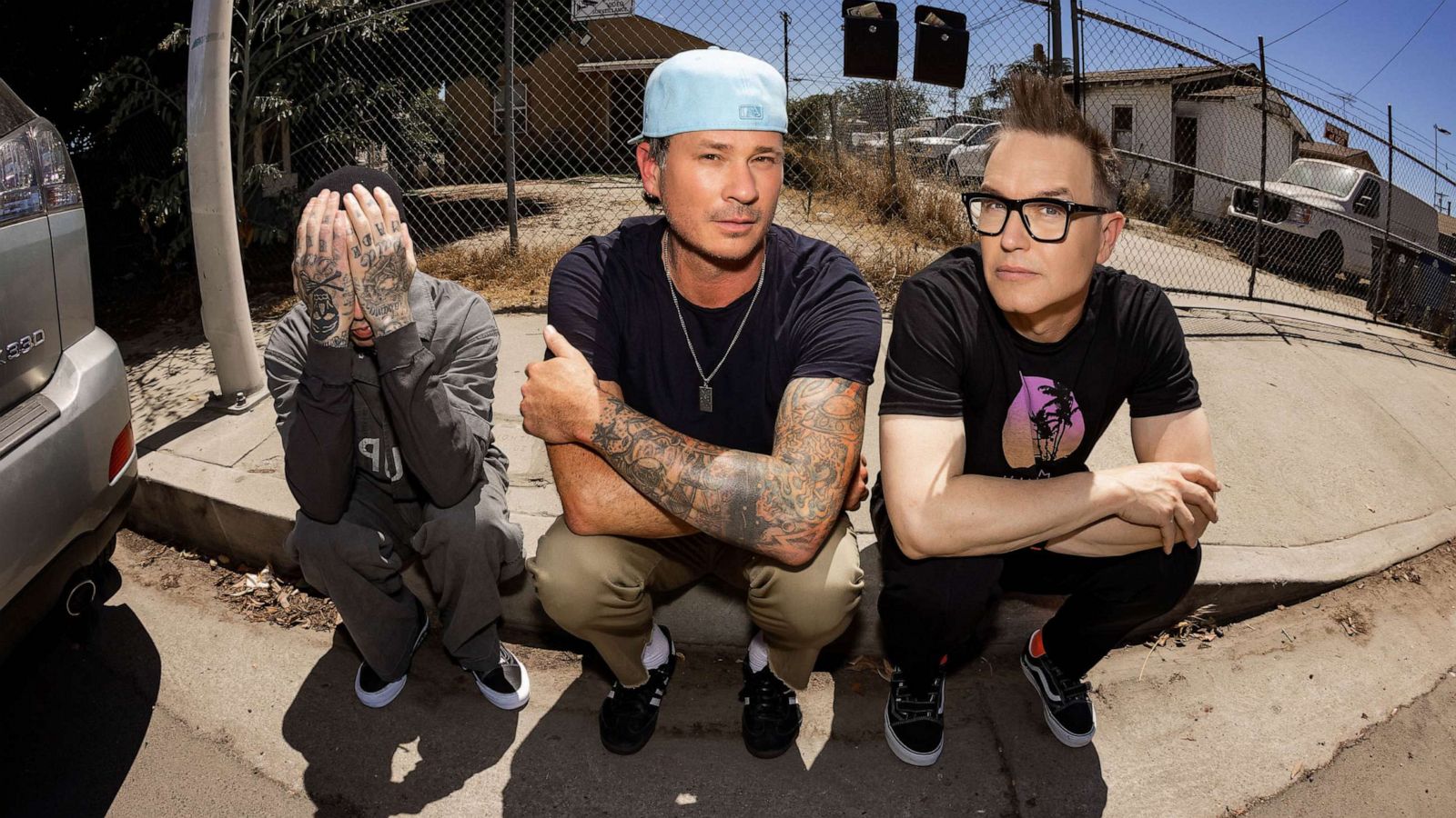 PHOTO: Blink-182 members Mark Hoppus, Tom DeLonge and Travis Barker pose together.