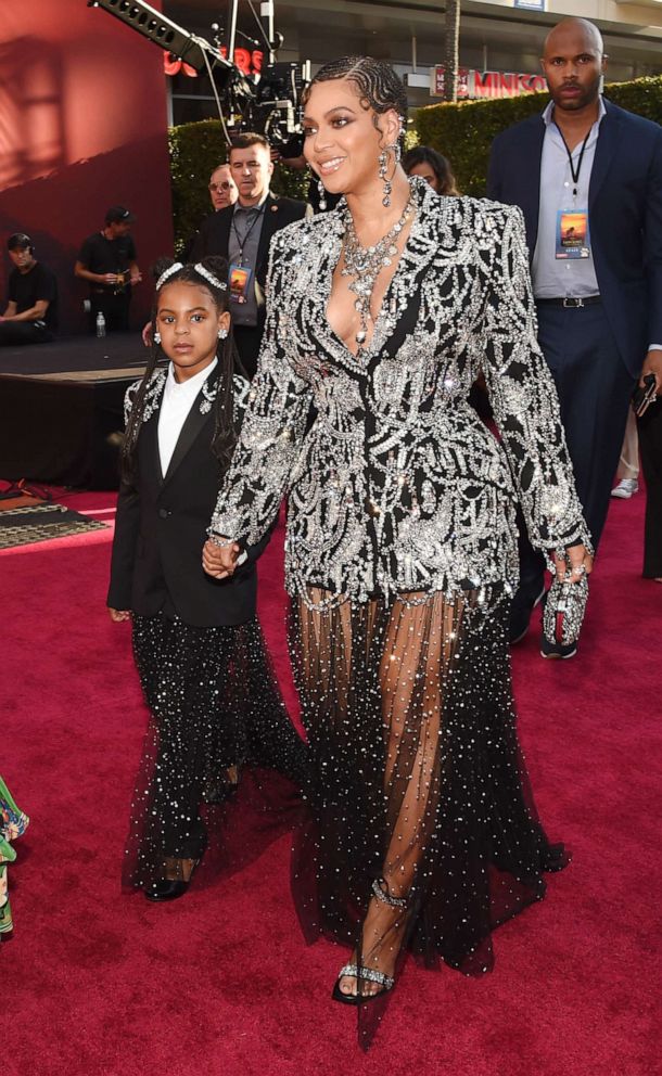 PHOTO: Beyonce, a cast member in "The Lion King," arrives with her daughter Blue Ivy at the premiere of the film, July 9, 2019, in Los Angeles.