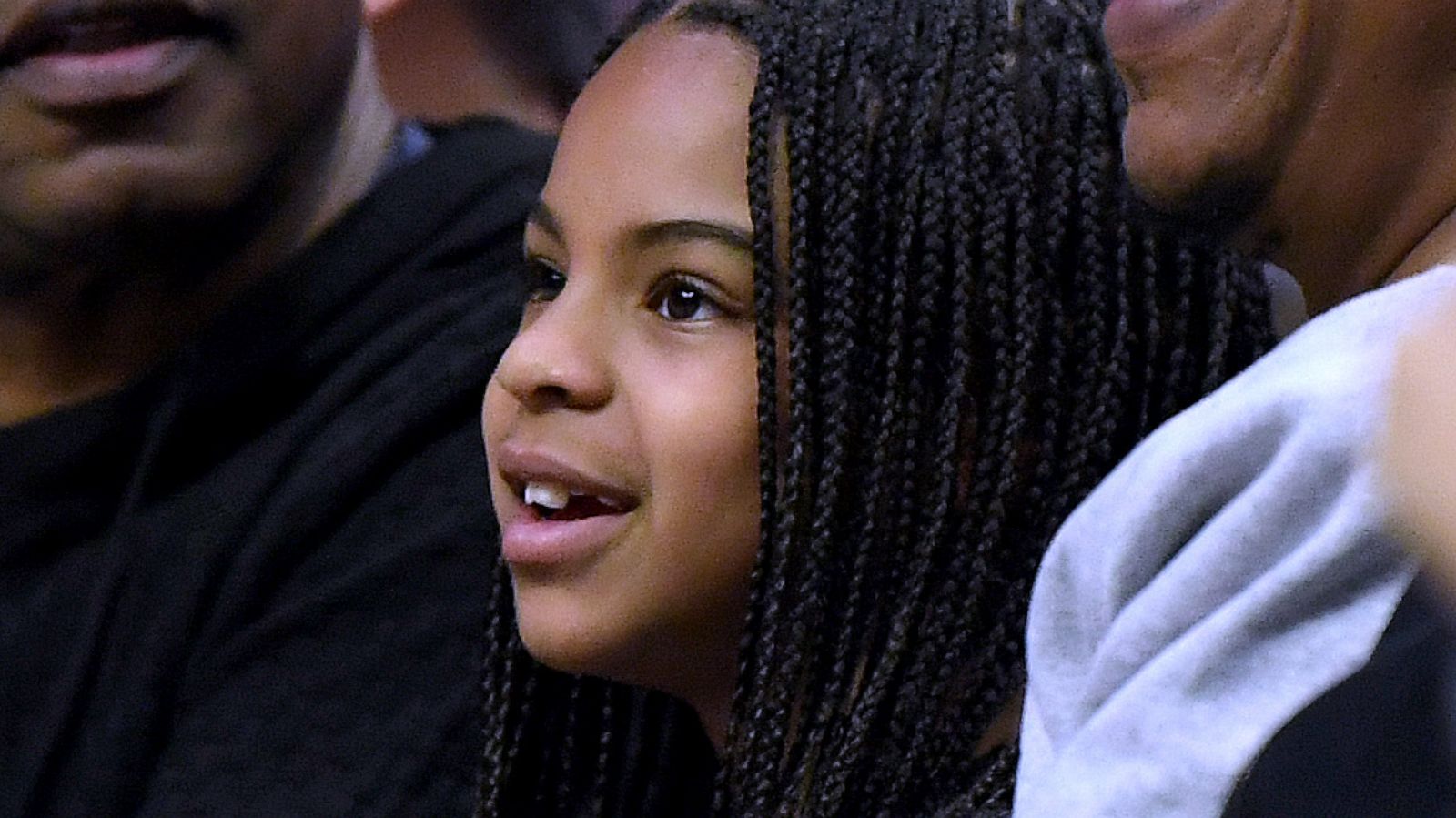 PHOTO: Jay-Z and Blue Ivy Carter smile during the game between the Los Angeles Lakers and the LA Clippers at Staples Center, March 8, 2020 in Los Angeles.