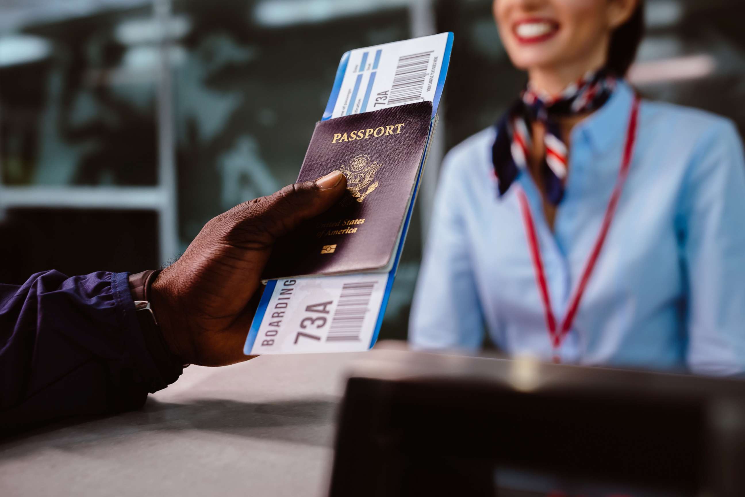 PHOTO: In this undated file photo, a man holds a boarding pass and a passport at an airline check-in desk.