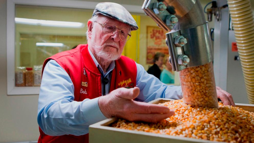 PHOTO: Bob Moore, founder of Bob's Red Mill and Natural Foods, inspects grains at the company's facility in Milwaukie, Oregon, U.S., on Tuesday, April 8, 2014. 