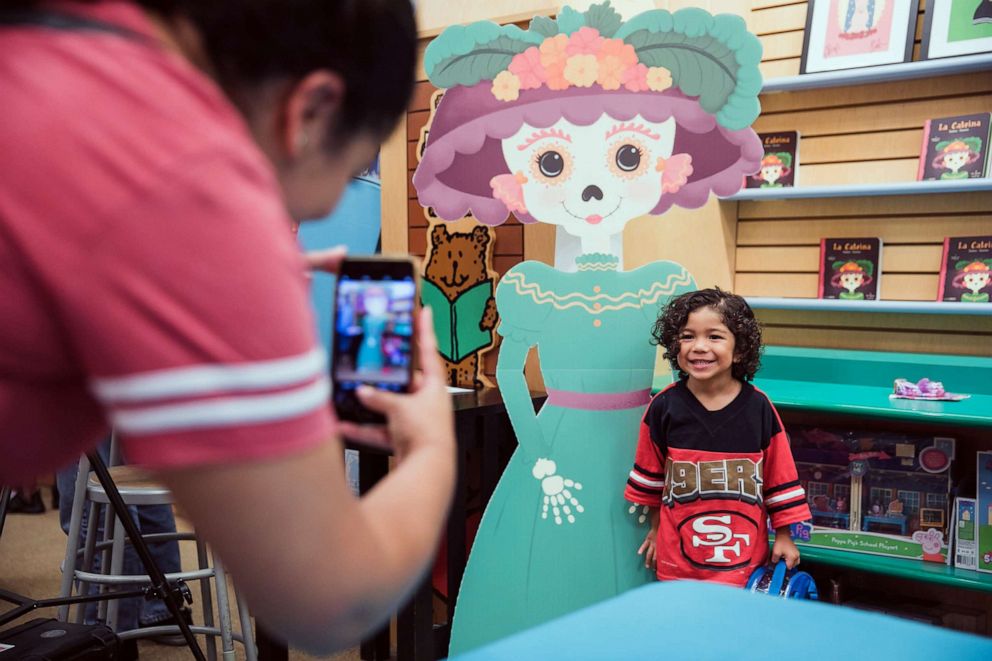 PHOTO: A child poses for a photo at a Lil' Libros book-signing event held at Barnes & Noble in Long Beach, Calif., in September 2017. 