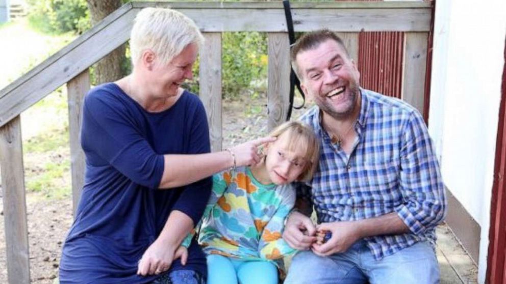 PHOTO: Freya Booker and family take a family photo together outdoors.