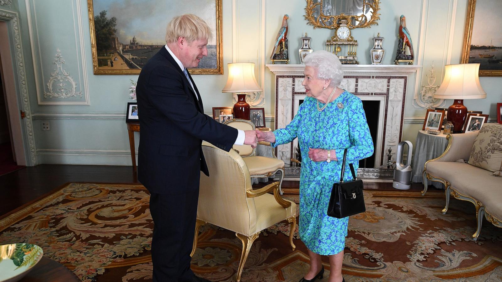 PHOTO: In this July 24, 2019, file photo, Queen Elizabeth II welcomes newly elected leader of the Conservative party, Boris Johnson at Buckingham Palace in London.