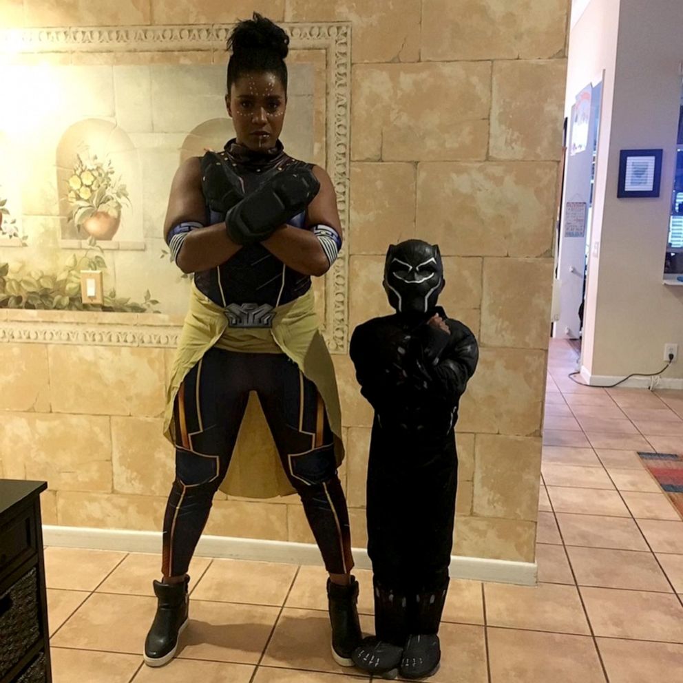 PHOTO: Jonah, 9, of Florida, dresses in a "Black Panther" costume alongside his mother, who says that seeing the film "was a very big deal for our family."