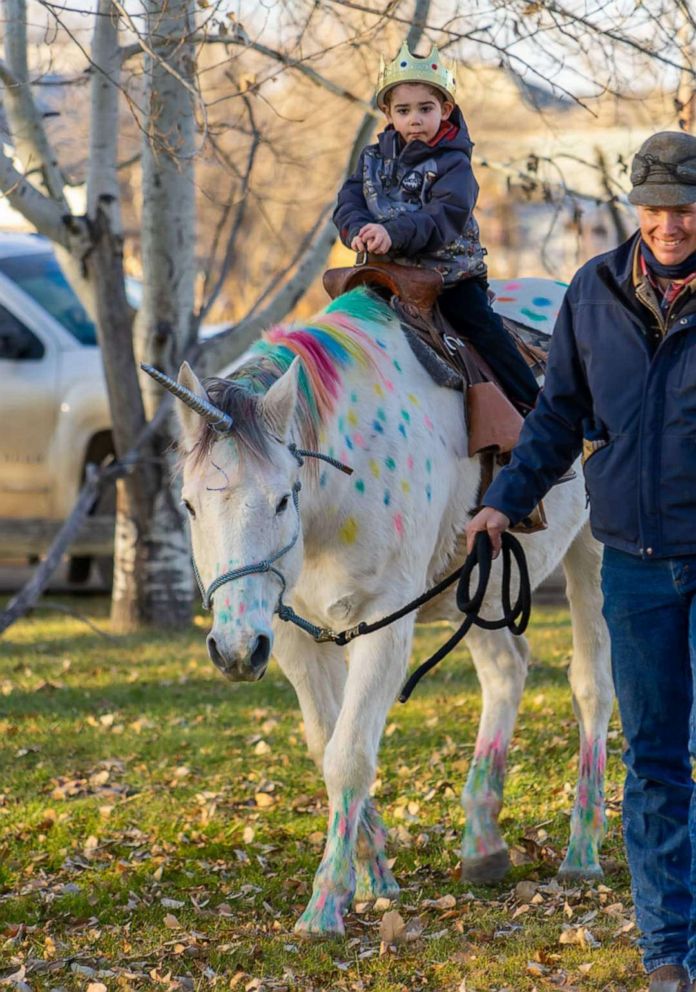 PHOTO: Wyatt Haas, a boy who loves unicorns met two in real life thanks to a send-off party from his kindergarten classmates in Fallon, Montana, on Dec. 6, as Wyatt heads to cancer treatment.