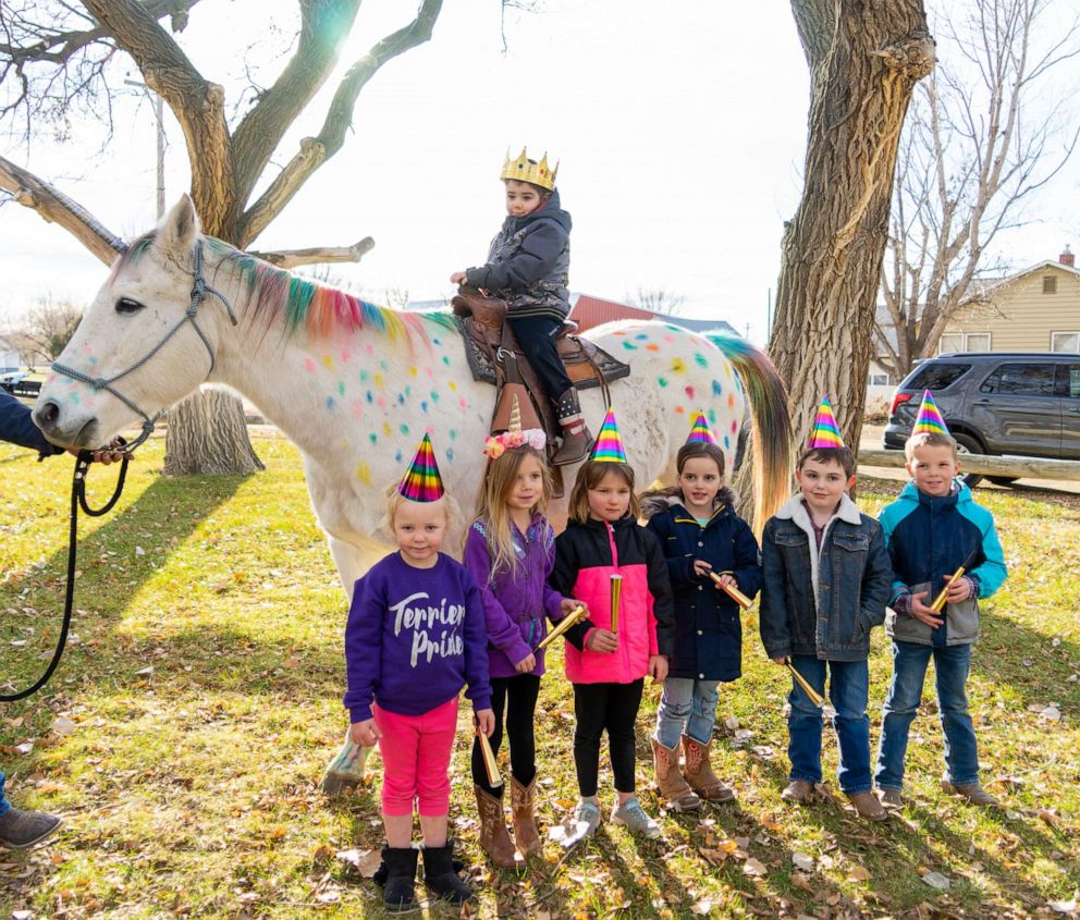 PHOTO: Wyatt Haas, a boy who loves unicorns met two in real life thanks to a send-off party from his kindergarten classmates in Fallon, Montana, on Dec. 6.