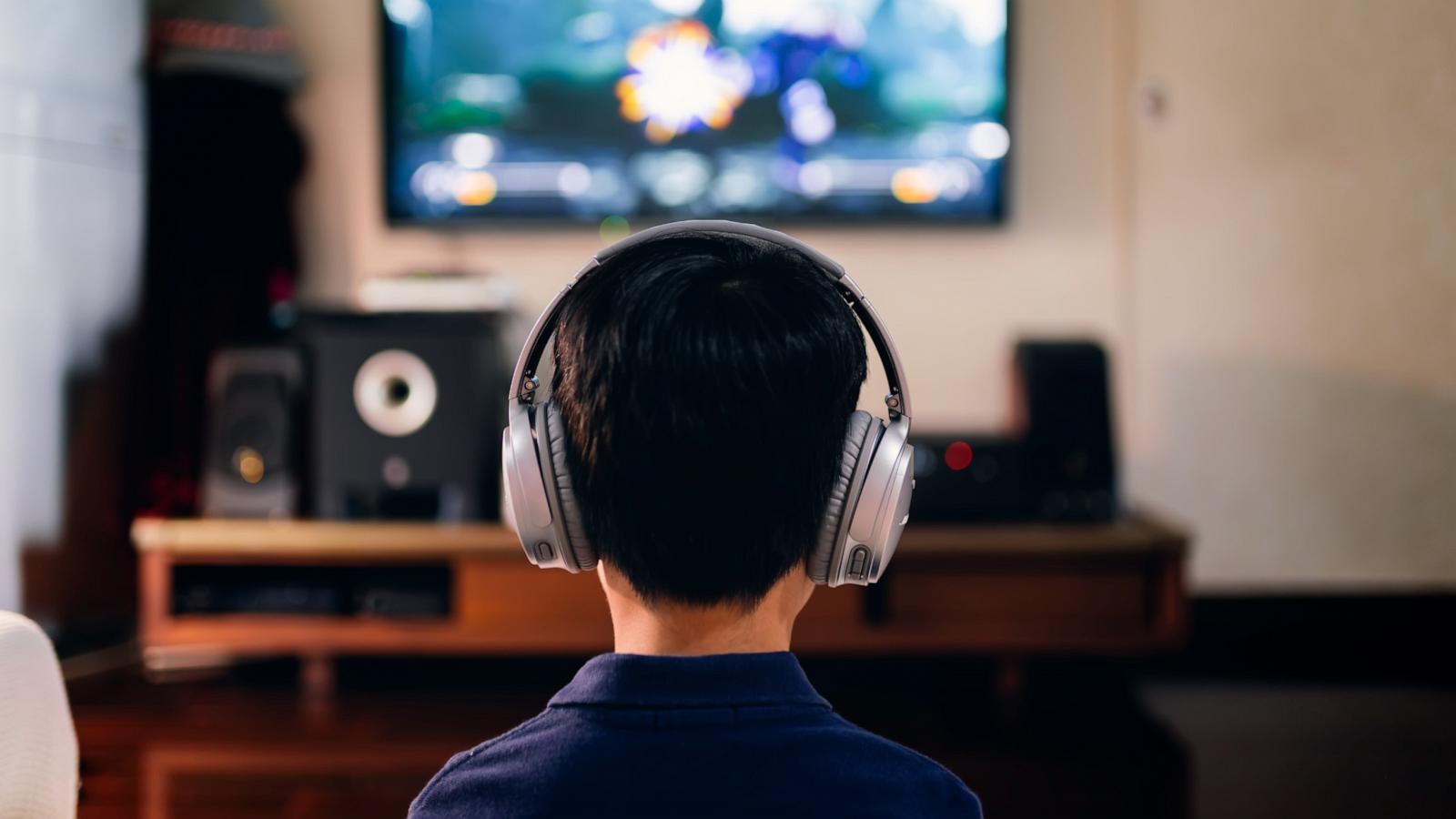 PHOTO: A boy is picture while playing video games in this stock photo.