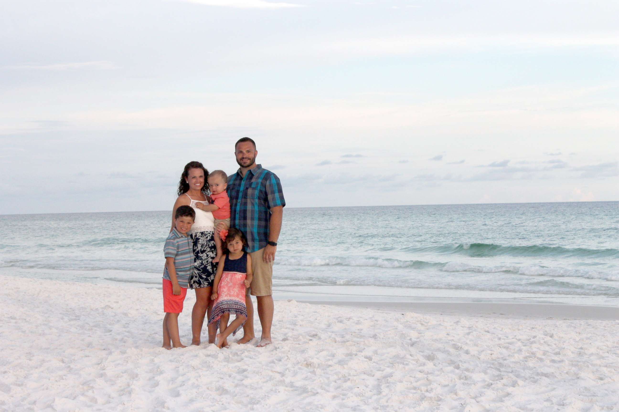 PHOTO: Adam and Whitney Dinkel of Overland Park, Kansas, seen in a photo while vacationing in Florida with their children, Layton, 6, Gracelyn, 4 and Roman, 2.
