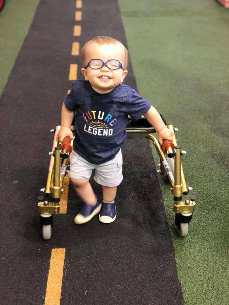 PHOTO: Roman Dinkel, 2, who was born with spina bifida, went viral after sharing the celebratory moment with his dog of him using crutches without assistance.