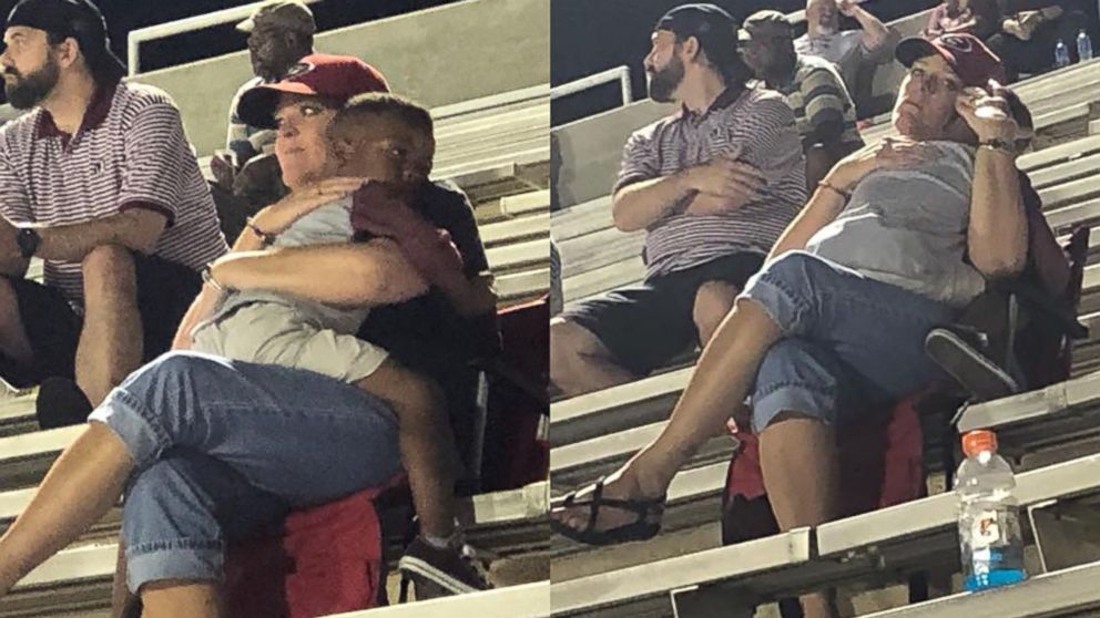 A photo of a four-year-old boy sitting in the lap of a stranger has touched hearts after going viral.