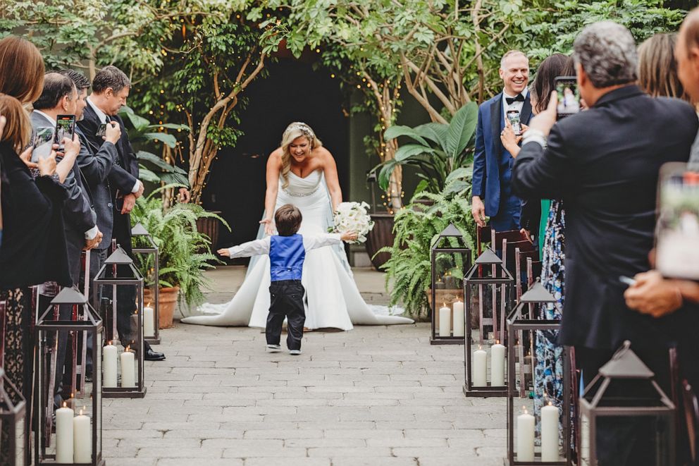 PHOTO: Mihelich reacts after her son greeted her before she walked down the aisle at her wedding.