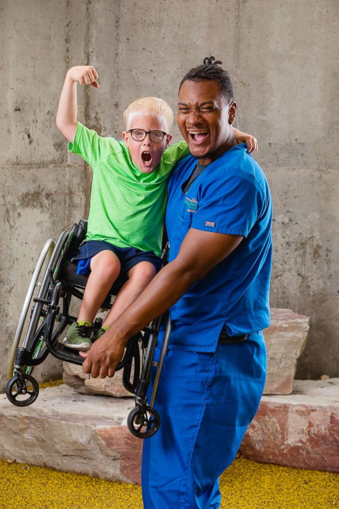 PHOTO: Lewis Miller (left) is an 8-year-old born with spina bifida and has been a Mary Free Bed patient his entire life and participates in the Junior Wheelchair Sports Camp. He is pictured with his dance partner, Peter Isabel.