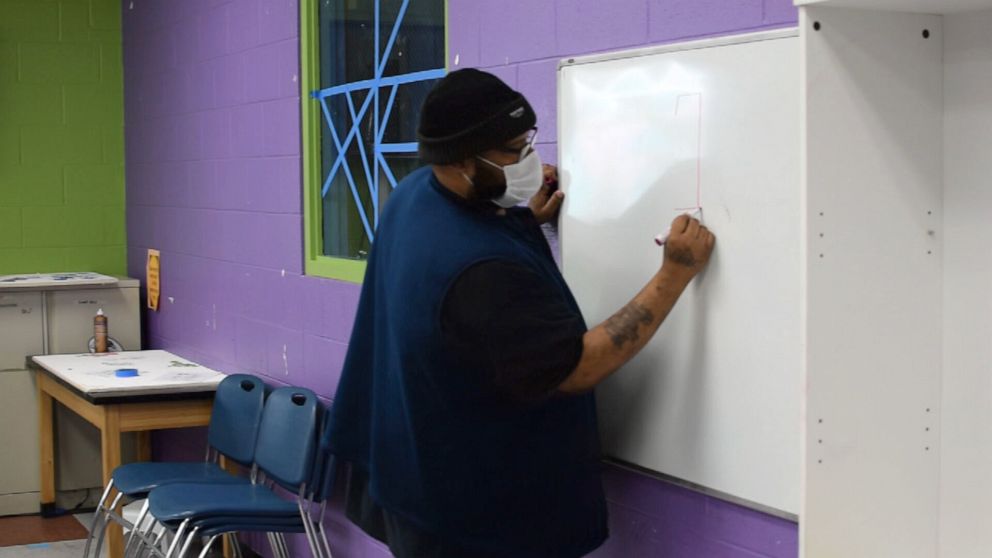 PHOTO: Vernon Bradford, branch director at a Boys and Girls Club in Edgewood, Maryland, teaches students of essential workers.