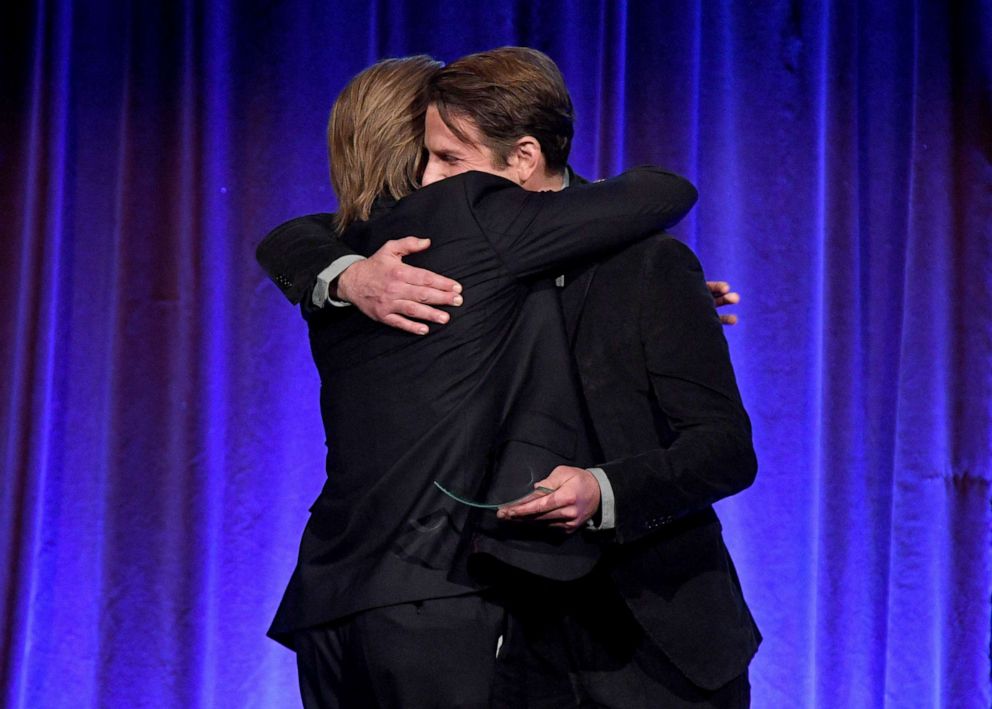 PHOTO: Brad Pitt, left, and Bradley Cooper embrace onstage during The National Board of Review Annual Awards Gala at Cipriani 42nd Street on Jan. 08, 2020, in New York City. 