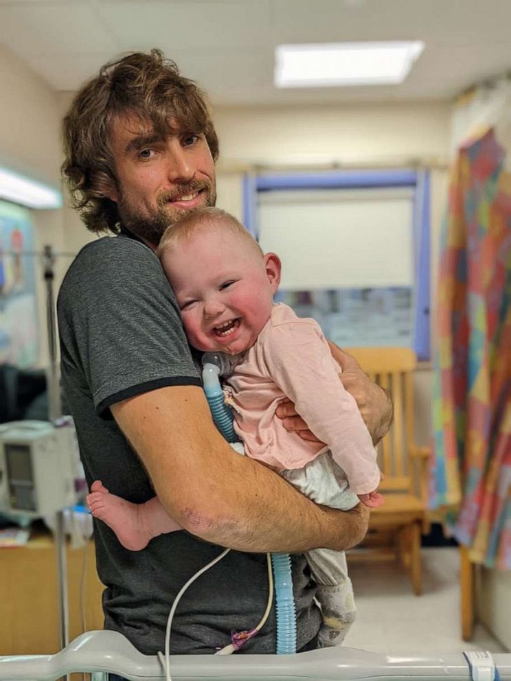 PHOTO: James Foster holds his daughter Bradi while she was in the NICU at Franciscan Children's in Boston.