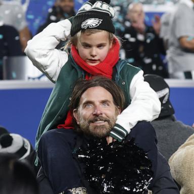 PHOTO: Bradley Cooper celebrates with his daughter Lea after the Eagles defeated the Washington Commanders in the NFC Championship game at Lincoln Financial Field, Jan. 26, 2025, in Philadelphia.