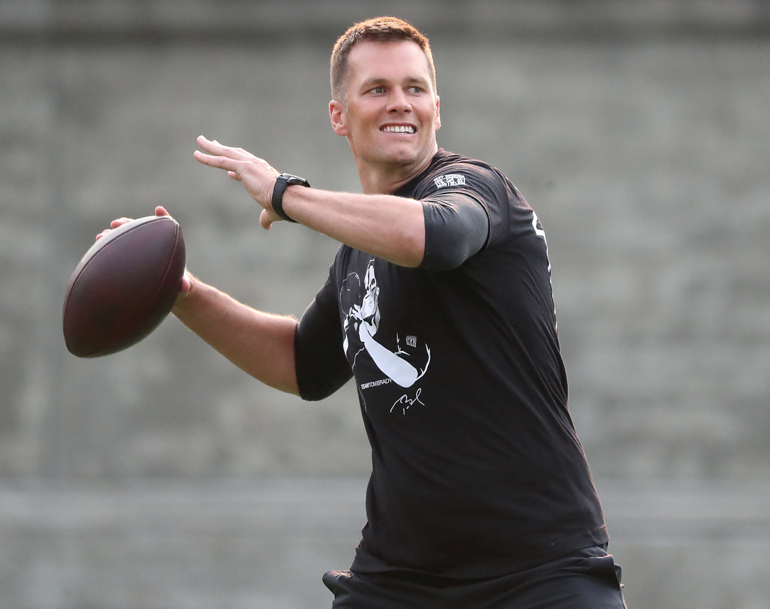 PHOTO: New England Patriots quarterback Tom Brady throws a pass during the 20th Annual Best Buddies Challenge at Harvard Stadium in Boston on May 31, 2019.