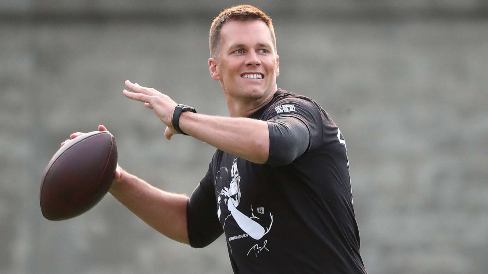 PHOTO: New England Patriots quarterback Tom Brady throws a pass during the 20th Annual Best Buddies Challenge at Harvard Stadium in Boston on May 31, 2019.