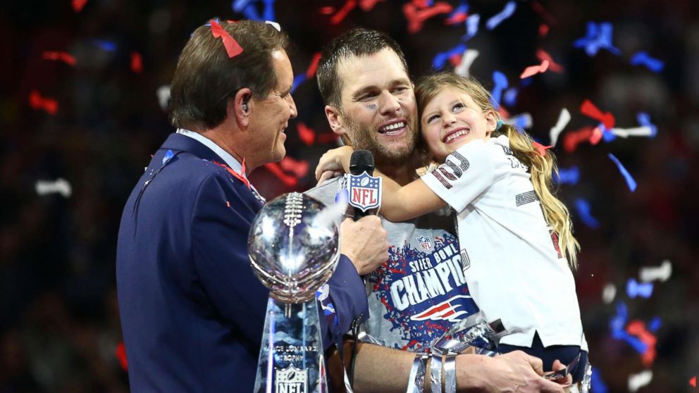 PHOTO: New England Patriots quarterback Tom Brady (12) and daughter Vivian celebrate as they are interviewed by CBS host Jim Nantz after Super Bowl LIII against the Los Angeles Rams at Mercedes-Benz Stadium in Atlanta, Feb 3, 2019.