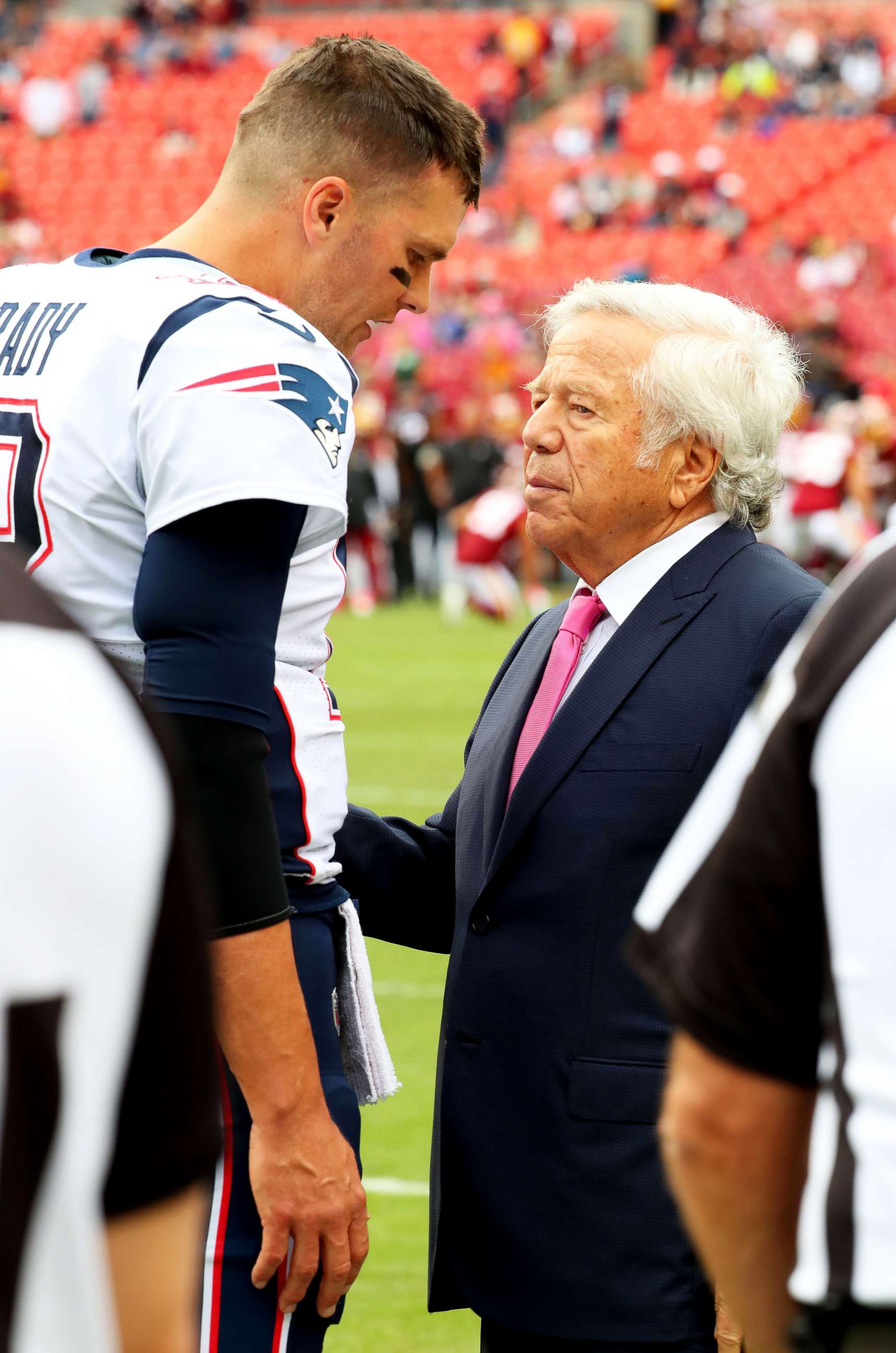 PHOTO: New England Patriots quarterback Tom Brady and Patriots owner Robert Kraft speak before an NFL game against the Washington Redskins at FedEx Field in Landover, Md., on Oct 6, 2019.