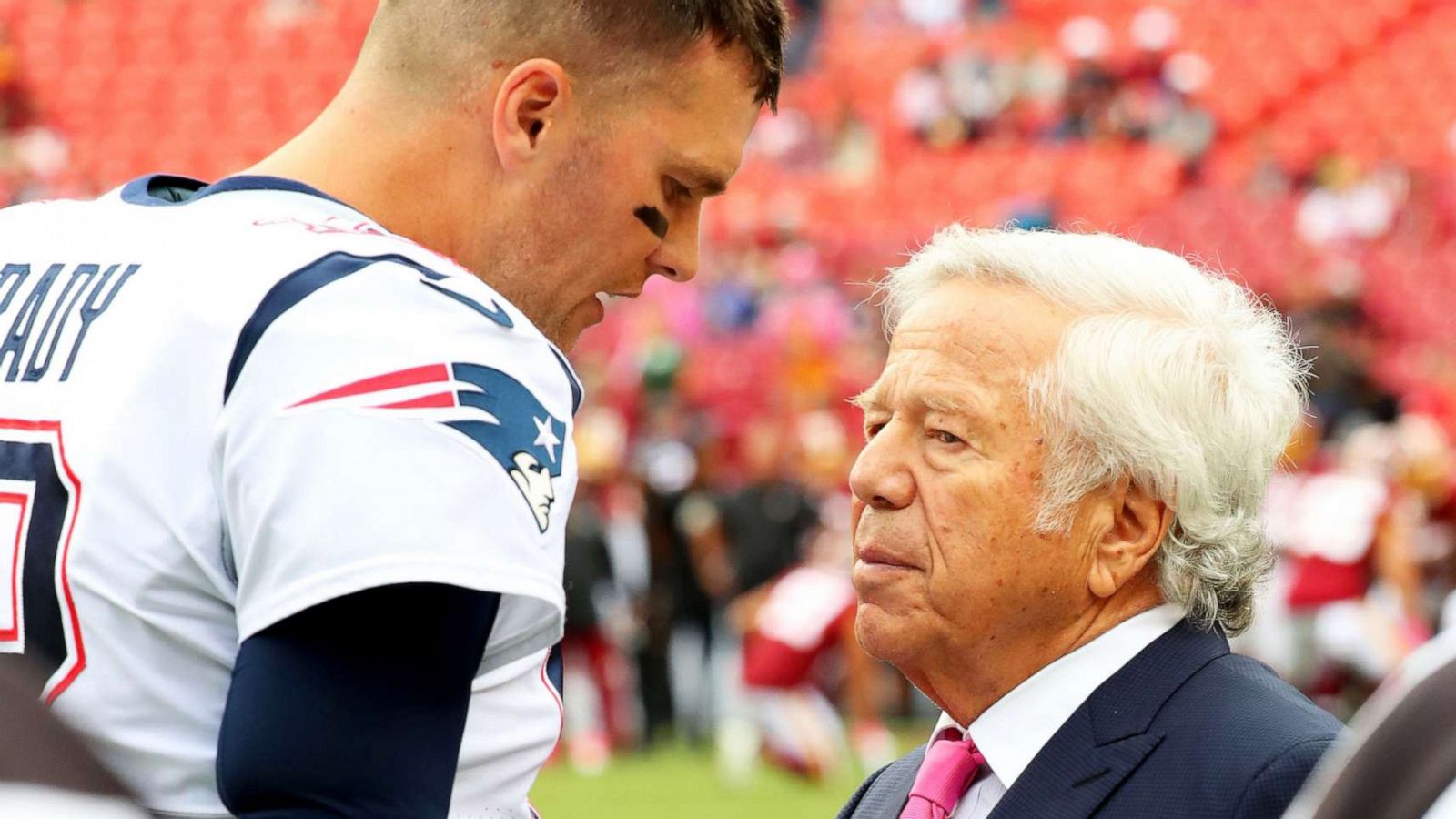 PHOTO: New England Patriots quarterback Tom Brady and Patriots owner Robert Kraft speak before an NFL game against the Washington Redskins at FedEx Field in Landover, Md., on Oct 6, 2019.