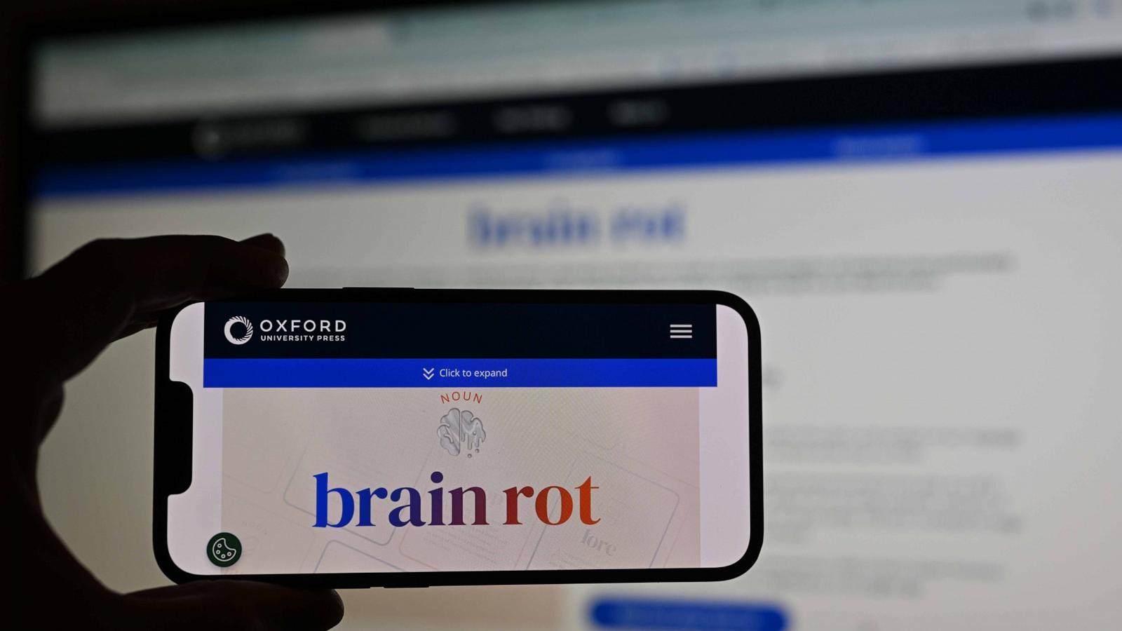 PHOTO: A man holds a phone, displaying word of ''brain rot'', as the Oxford Dictionary has chosen the word, which refers to the unnecessary and entertaining use of social media, as the word of the year in London, Dec. 2, 2024.