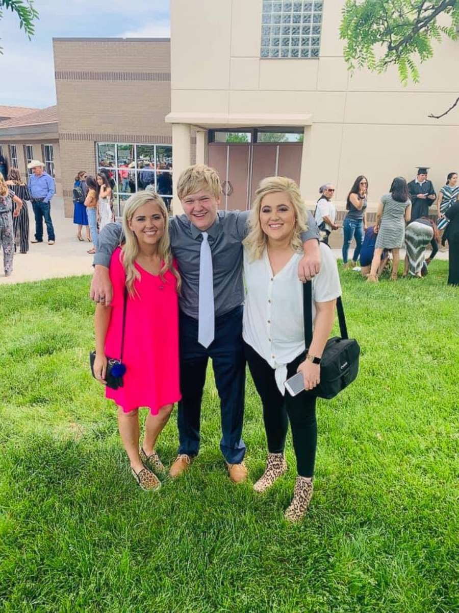 PHOTO: Braxton Moral, 17, of Ulysses, Kansas, is seen with his sisters, Brittney Jo Seger and Brandi Zamarripa, on the day he graduated from Ulysses High School on May 19.