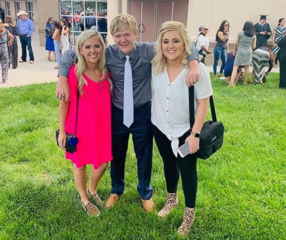 PHOTO: Braxton Moral, 17, of Ulysses, Kansas, is seen with his sisters, Brittney Jo Seger and Brandi Zamarripa, on the day he graduated from Ulysses High School on May 19.