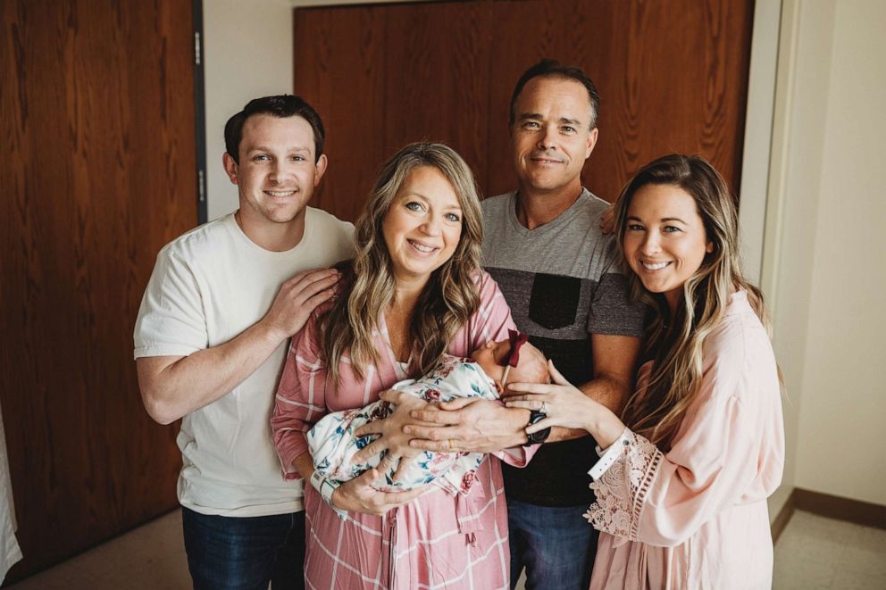 PHOTO: Breanna Lockwood, center, poses with her husband, parents and newborn daughter Briar.