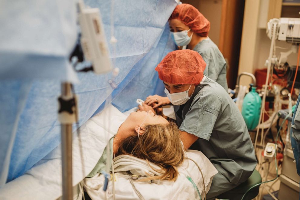 PHOTO: Breanna Lockwood, far right, holds her mom's hand during the delivery of Lockwood's daughter.